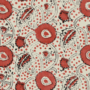 A stylised floral printed on linen fabric in red, black and cream