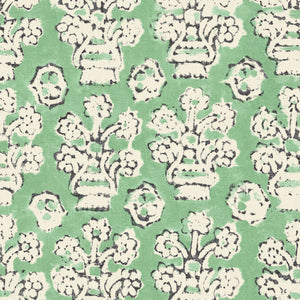 A jolly printed linen fabric in green, black and cream