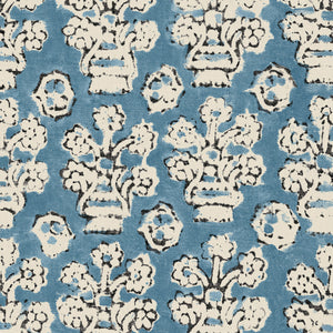 A jolly printed linen fabric in blue, black and cream