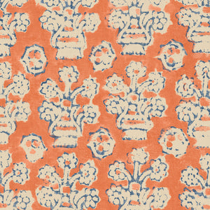 A jolly printed linen fabric in orange, blue and cream