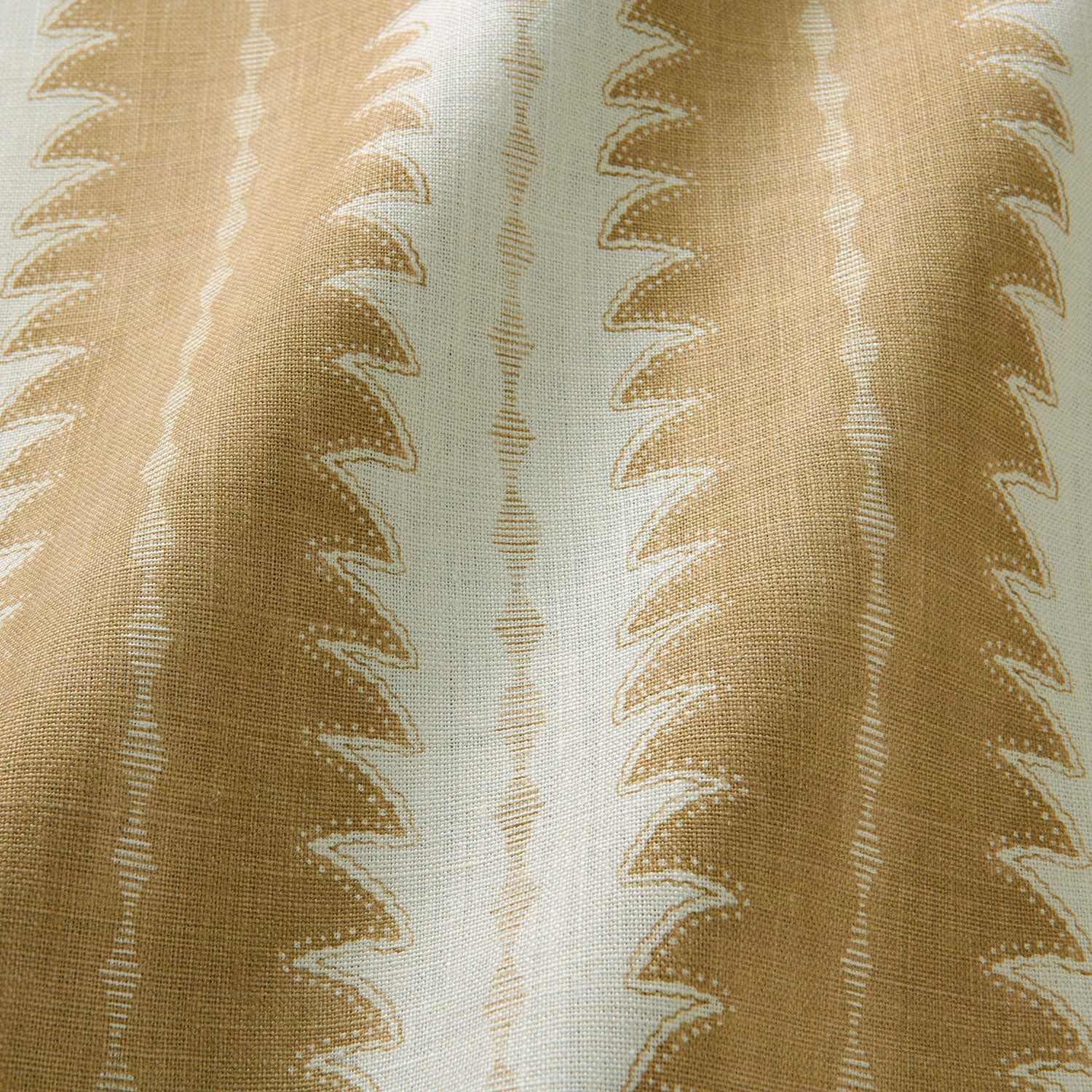 A printed linen fabric sample in beige and off white featuring a striped fern design.