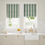 Blinds made from a printed linen fabric in blue and off white, featuring a striped fern design.