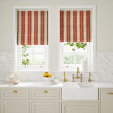 Blinds made from a printed linen fabric in red and off white, featuring a striped fern design.