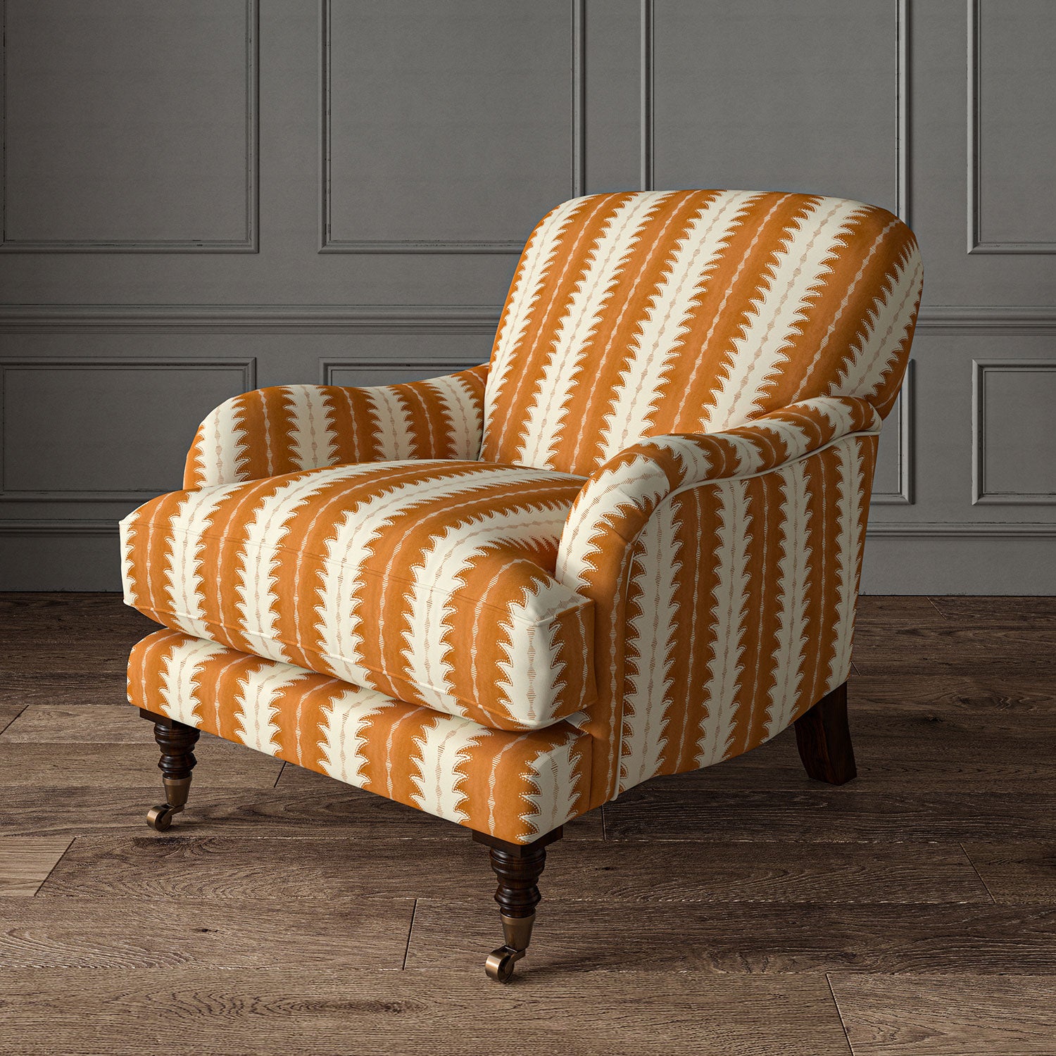 Armchair upholstered in a printed linen fabric in orange and off white, featuring a striped fern design.