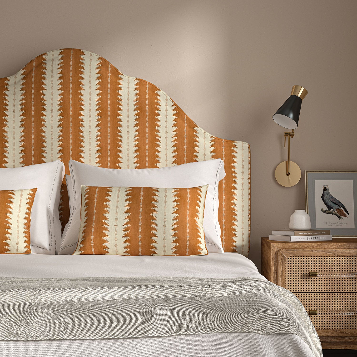 Headboard upholstered in a printed linen fabric in orange and off white, featuring a striped fern design.