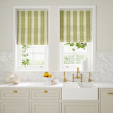 Blinds made from a printed linen fabric in green and off white, featuring a striped fern design.