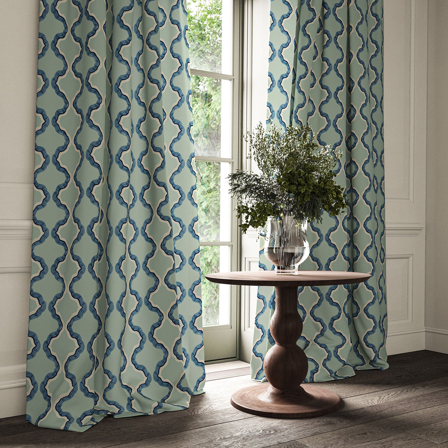 Curtains made from a printed linen fabric in blue and off white featuring a mirrored ribbon pattern.
