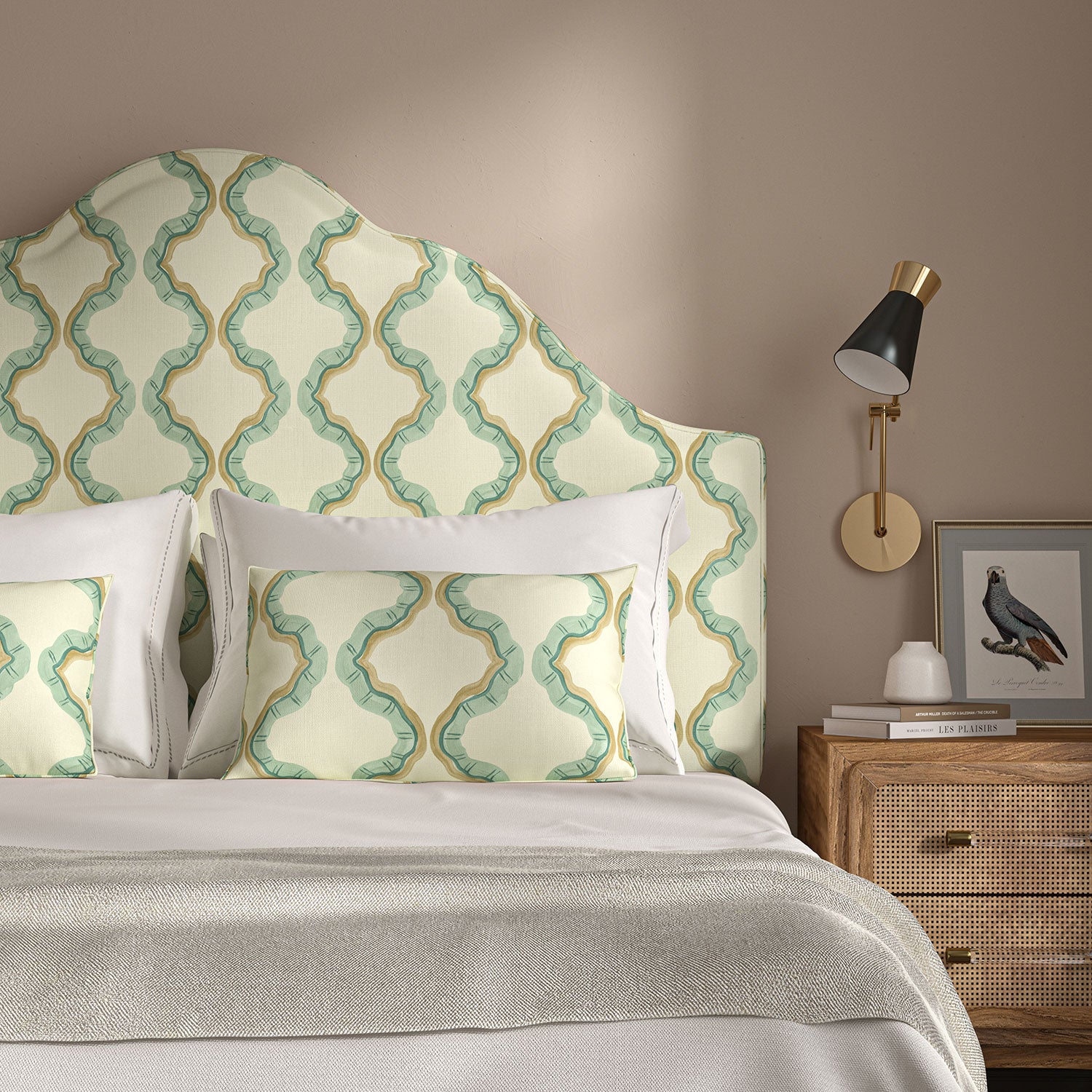 Headboard upholstered in a printed linen fabric in blue, brown, and off white featuring a mirrored ribbon pattern.