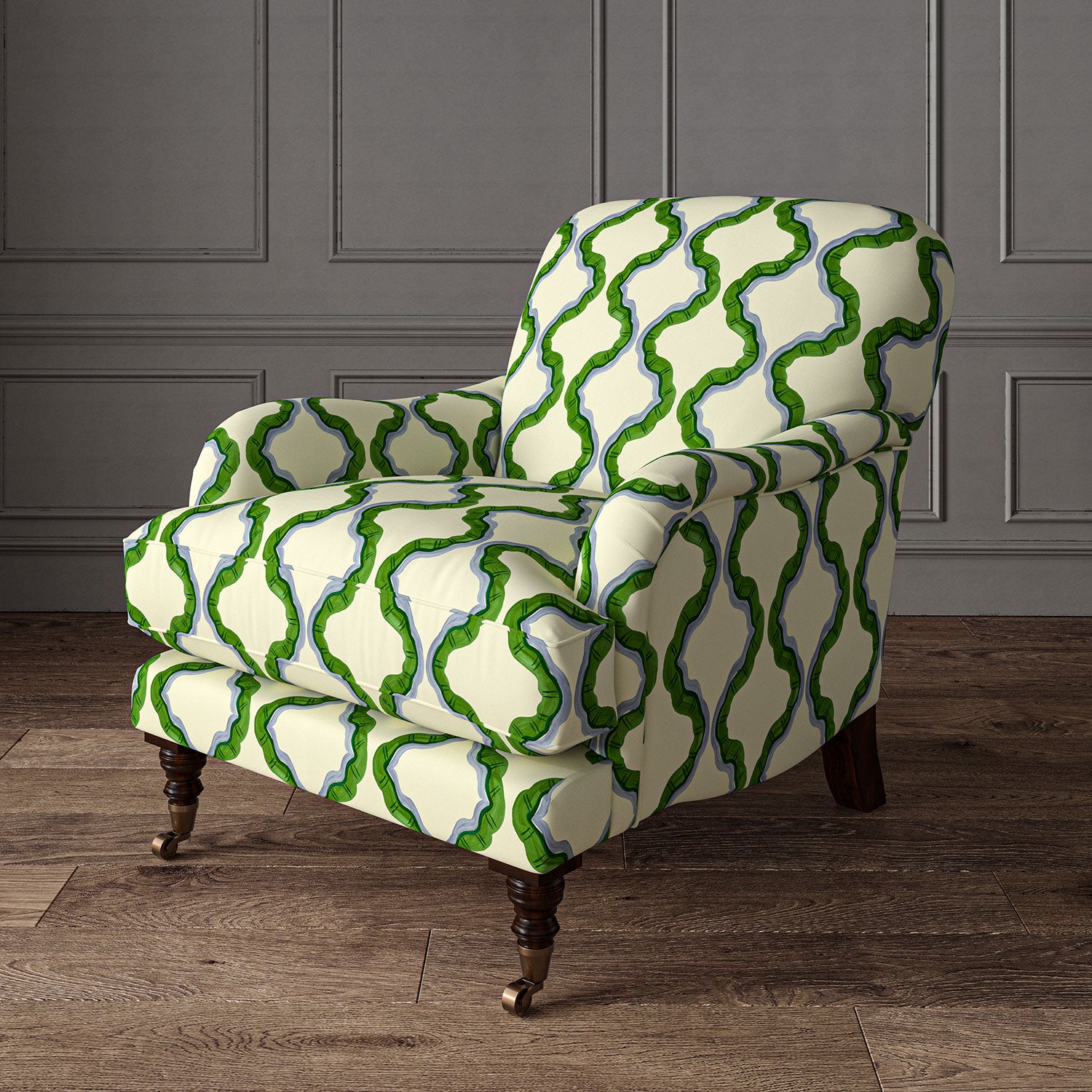 Armchair upholstered in a printed linen fabric in green, blue, and off white featuring a mirrored ribbon pattern.