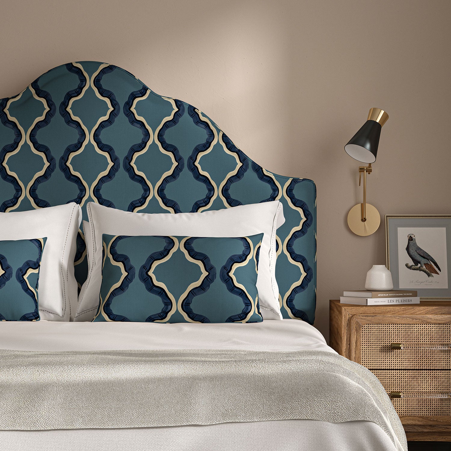 Headboard upholstered in a printed linen fabric in blue, black, and off white featuring a mirrored ribbon pattern.