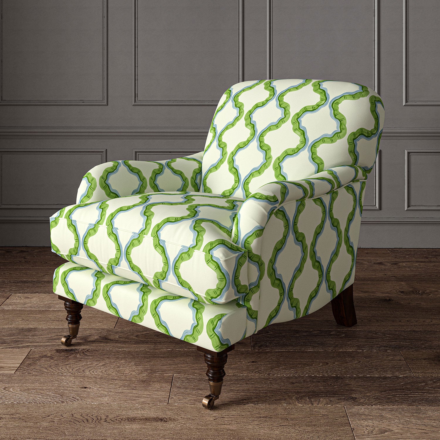 Armchair upholstered in a printed linen fabric in blue, green, and off white featuring a mirrored ribbon pattern.