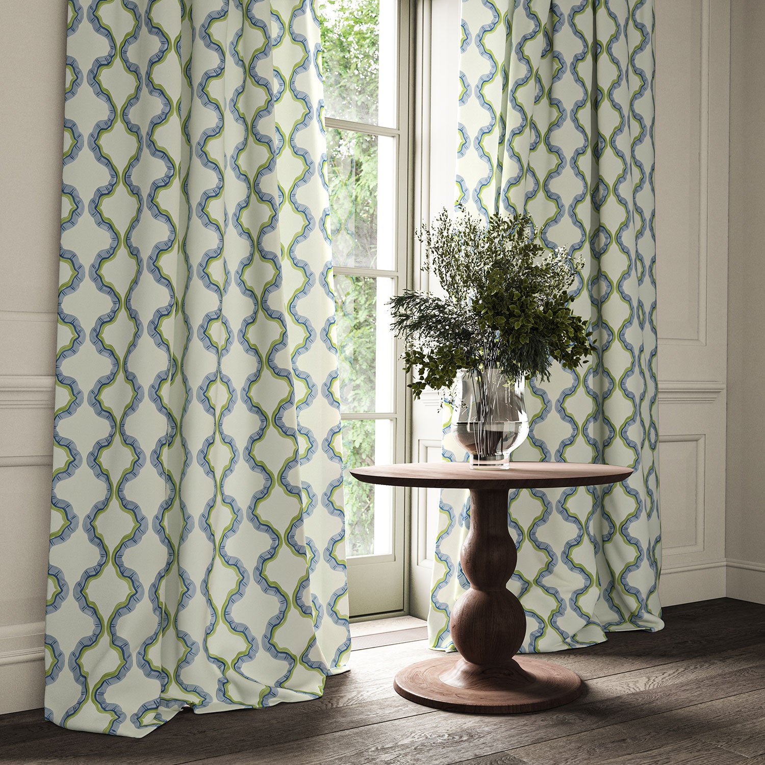 Curtains made from a printed linen fabric in blue, green, and off white featuring a mirrored ribbon pattern.