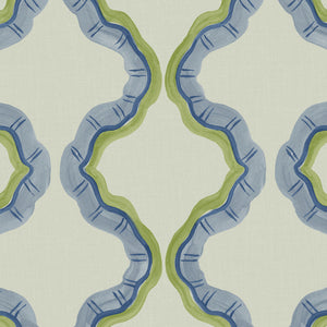 A printed linen fabric sample in blue, green, and off white featuring a mirrored ribbon pattern.