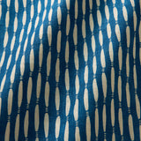 A printed linen fabric sample in blue and off white featuring a Japanese print.