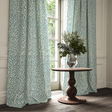 Curtains made from a printed linen fabric in blue and off white featuring a feel of a classic animal print.