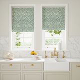 Blinds made from a printed linen fabric in blue and off white featuring a feel of a classic animal print.