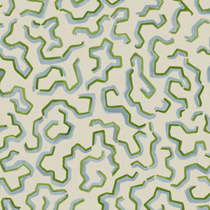 A printed linen fabric sample in blue, green, and off white featuring a feel of a classic animal print.