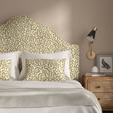 Headboard upholstered in a printed linen fabric in brown, beige, and off white featuring a feel of a classic animal print.