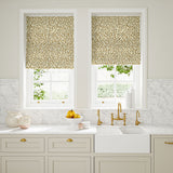 Blinds made from a printed linen fabric in brown, beige, and off white featuring a feel of a classic animal print.