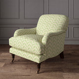 Armchair upholstered in a printed linen fabric in green, pink, and off white featuring a Japanese print.
