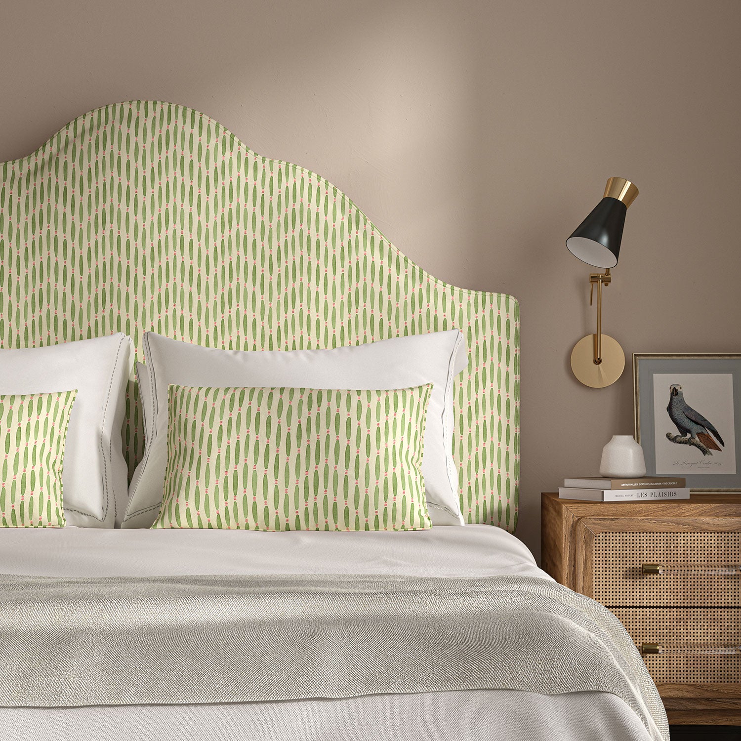Headboard upholstered in a printed linen fabric in green, pink, and off white featuring a Japanese print.