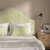 Headboard upholstered in a printed linen fabric in green, pink, and off white featuring a Japanese print.