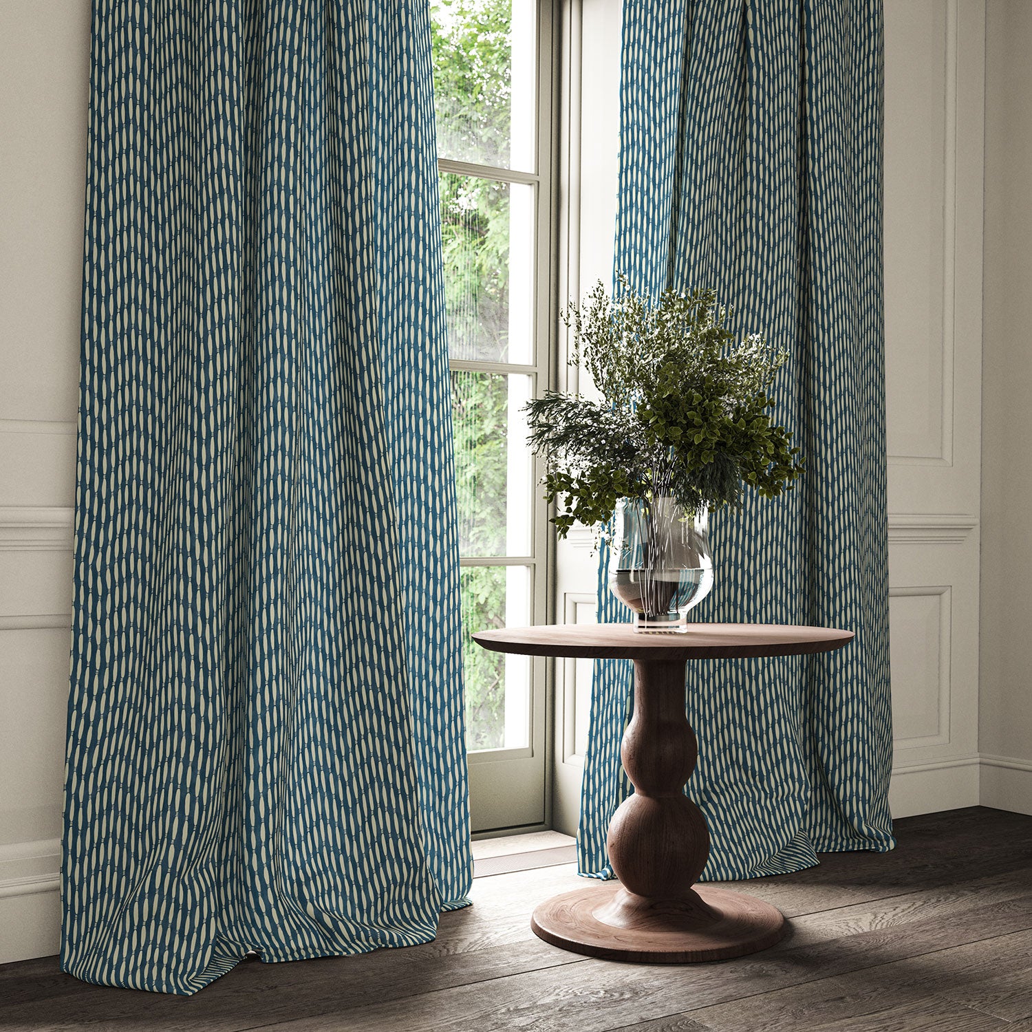Curtains made from a printed linen fabric in blue and off white featuring a Japanese print.