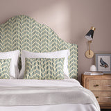Headboard upholstered in a printed linen fabric in blue, orange, and off white featuring a Japanese print.