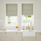 Blinds made from a printed linen fabric in blue, orange, and off white featuring a Japanese print.