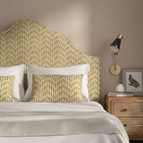 Headboard upholstered in a printed linen fabric in orange and off white featuring a Japanese print.
