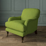 Armchair in Loxley Apple by Linwood – durable, Italian-woven natural fibre fabric in soft green.