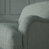 Close up of armchair in Loxley Bluestone by Linwood – durable, Italian-woven natural fibre fabric in muted blue.