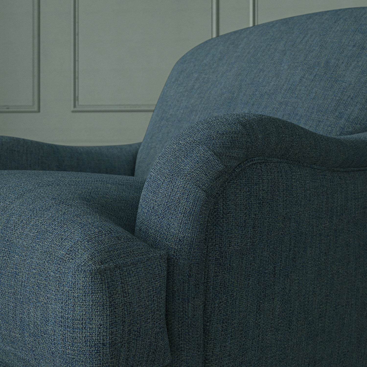 Close up of armchair in Loxley Denim by Linwood – durable, Italian-woven natural fibre fabric in deep blue.