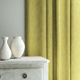 Curtain in Loxley Lime by Linwood – green Italian-woven fabric with rich texture and depth.