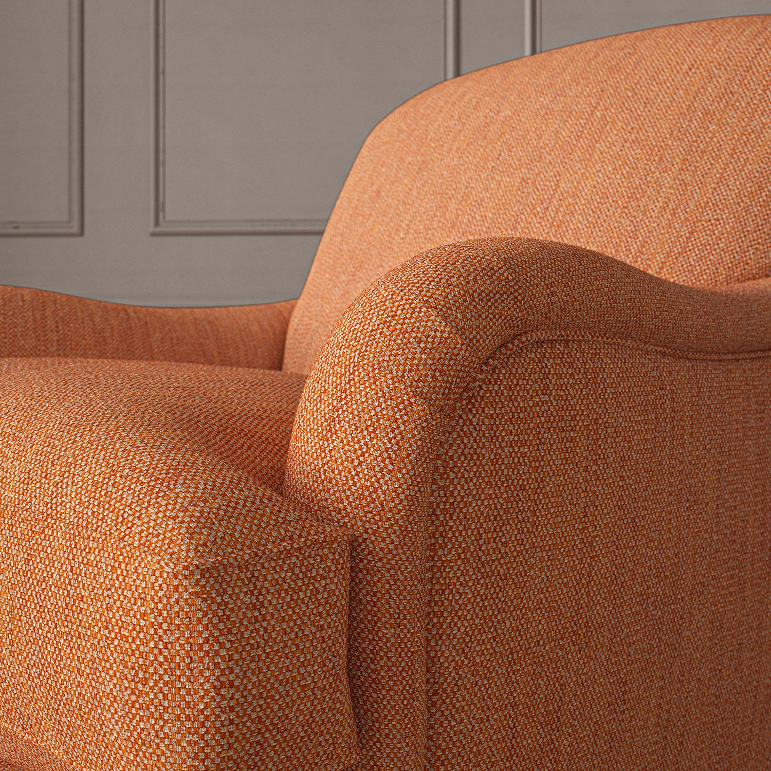 Close-up of armchair in Loxley Marmalade by Linwood – durable, Italian-woven natural fibre fabric in rich burnt orange.