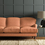 Sofa in Linwood’s Loxley Punch – Italian-woven pink-red fabric with tactile texture and versatility.