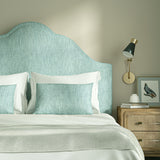 Upholstered headboard in Loxley Sky by Linwood – Italian-woven blue weave.