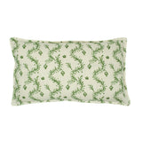 A green and cream linen cushion with a marine-style pattern.