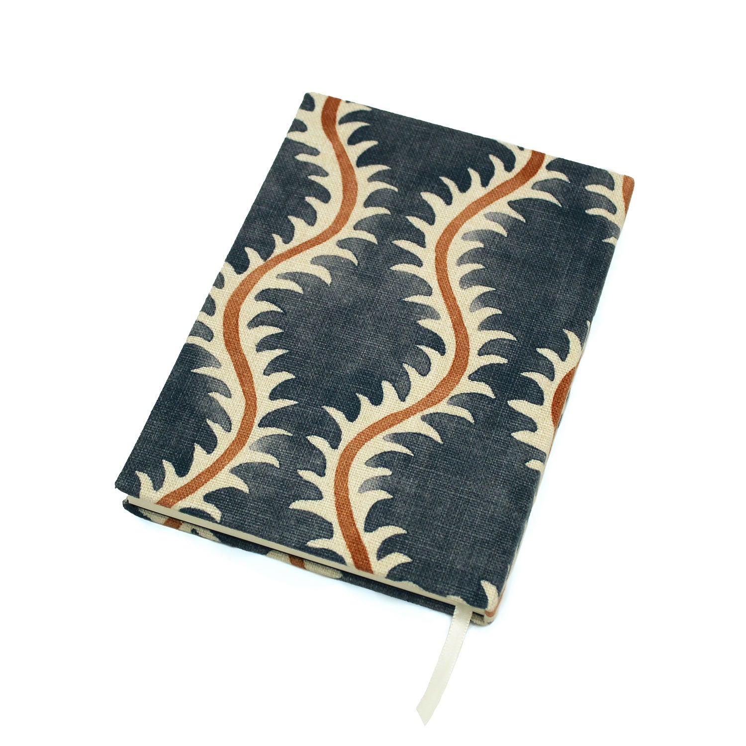 A blue, brown and cream linen notebook with a classic trellis pattern.