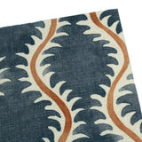 A blue, brown and cream linen notebook with a classic trellis pattern.