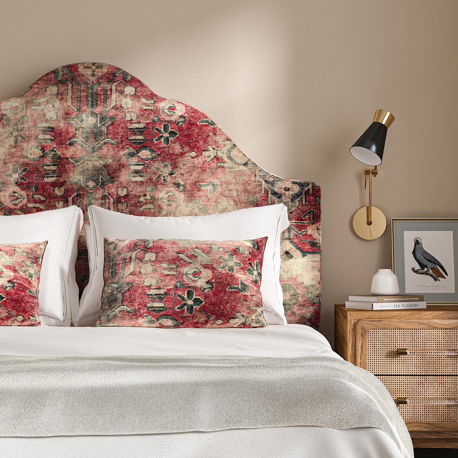 Headboard upholstered in a printed velvet fabric in red with the feel of a vintage rug.