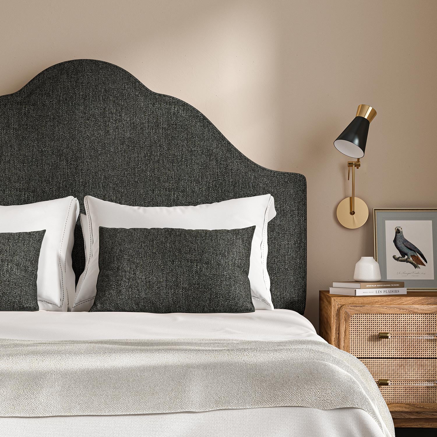 Headboard upholstered in a plain luxurious woven fabric in grey.