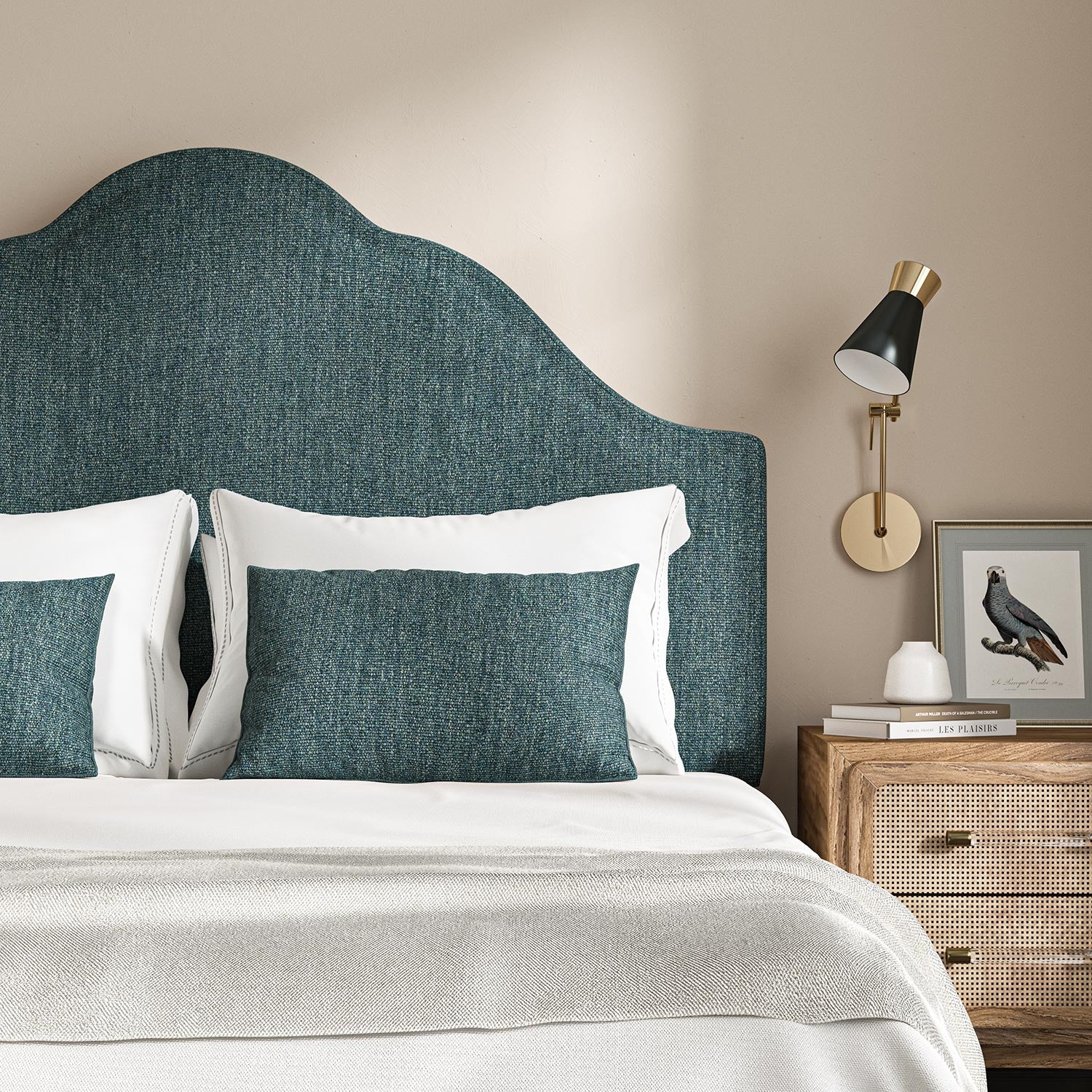 Headboard upholstered in a plain luxurious woven fabric in blue.