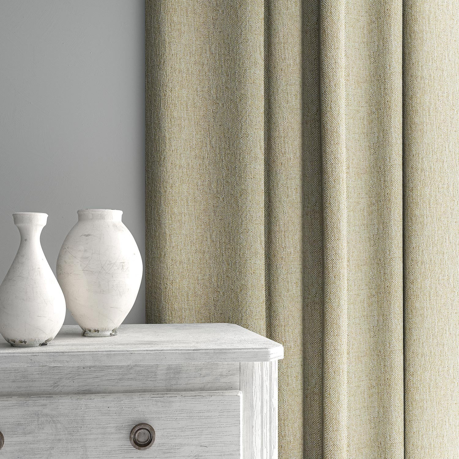 Curtain made from a plain luxurious woven fabric in cream.