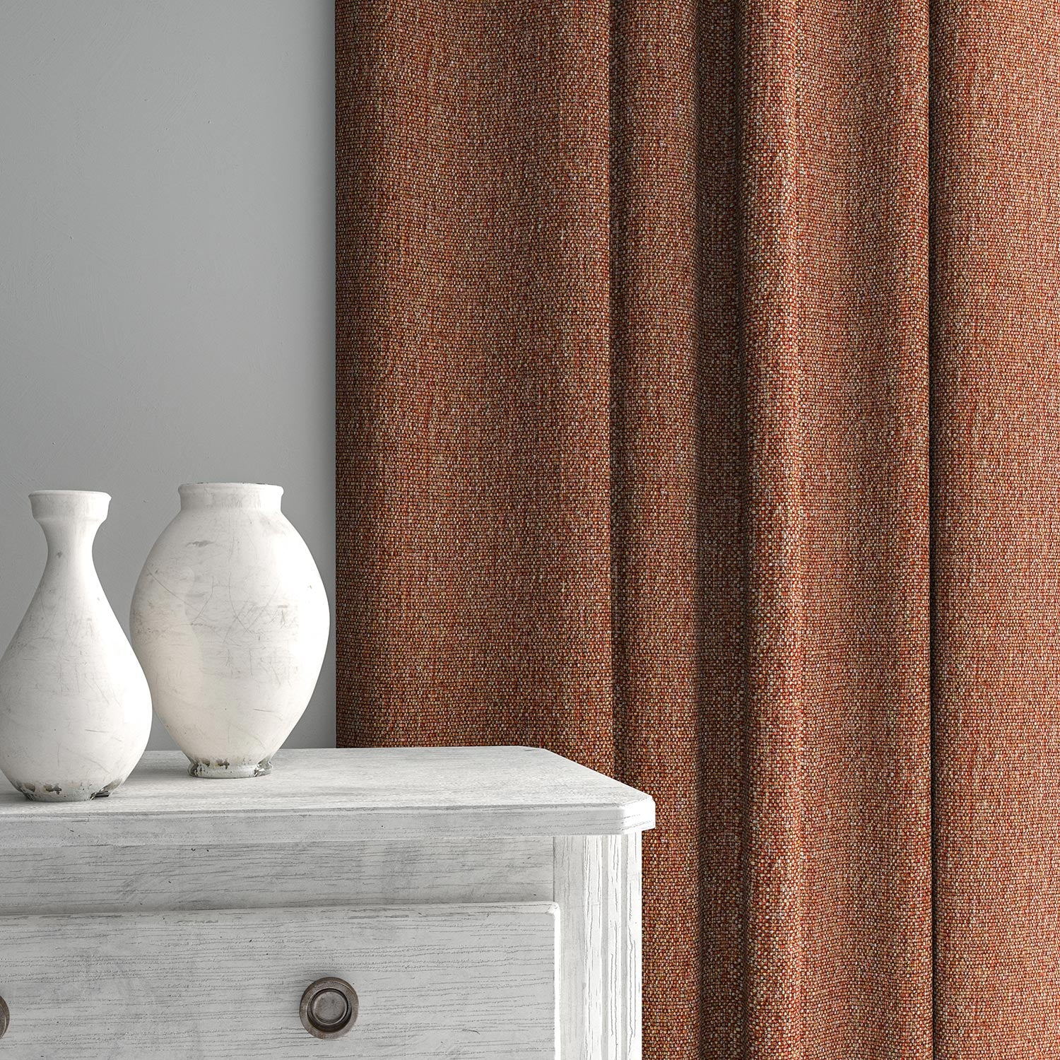 Curtain made from a plain luxurious woven fabric in red.