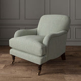 Chair upholstered in a plain luxurious woven fabric in blue and cream.