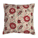 A red, black and cream linen cushion with a stylised floral pattern.