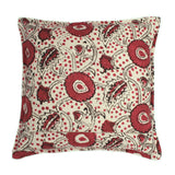 A red, black and cream linen cushion with a stylised floral pattern.