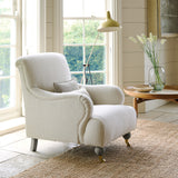 Chair covered in a boucle fabric in Almond