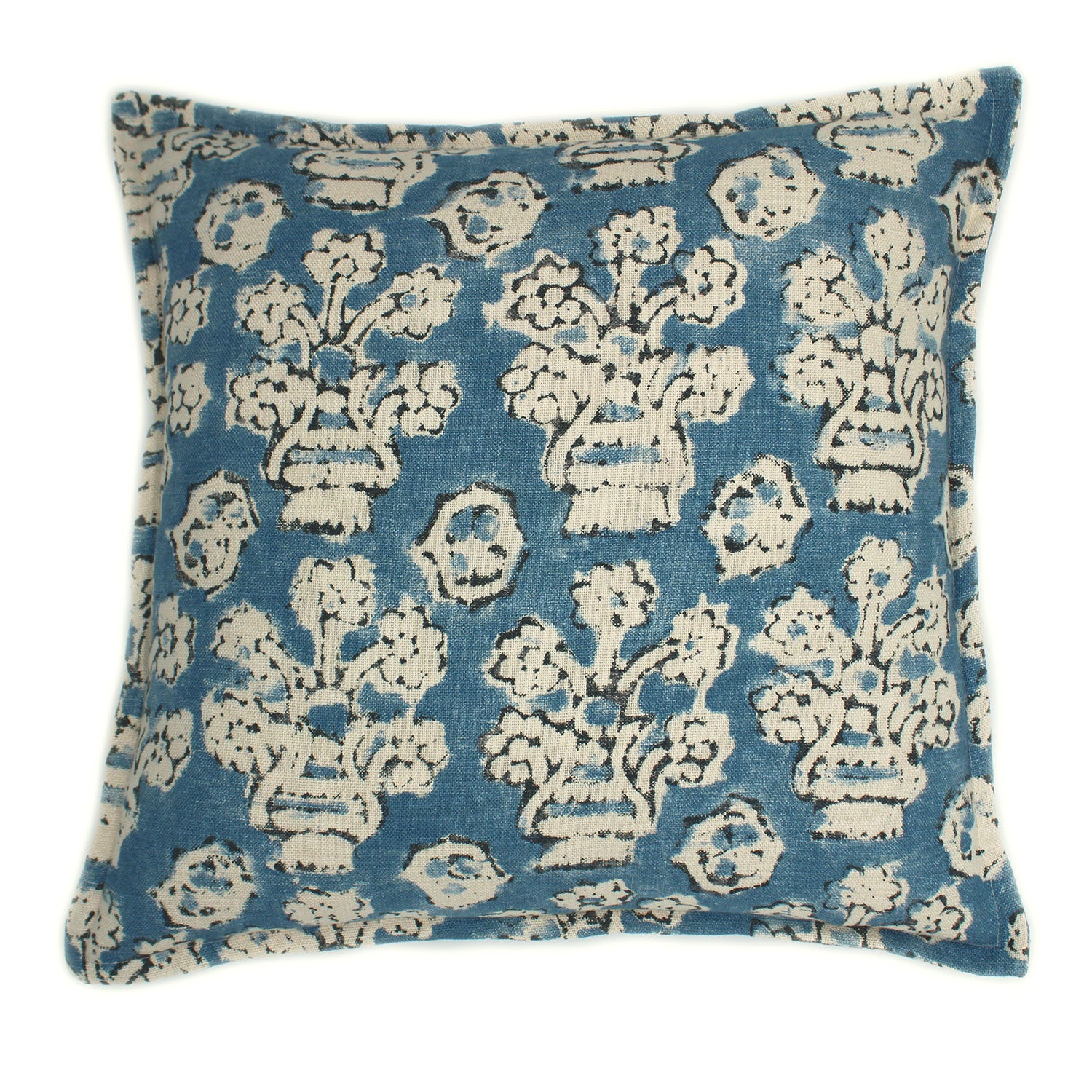 A blue, cream and black linen cushion with a block print pattern.